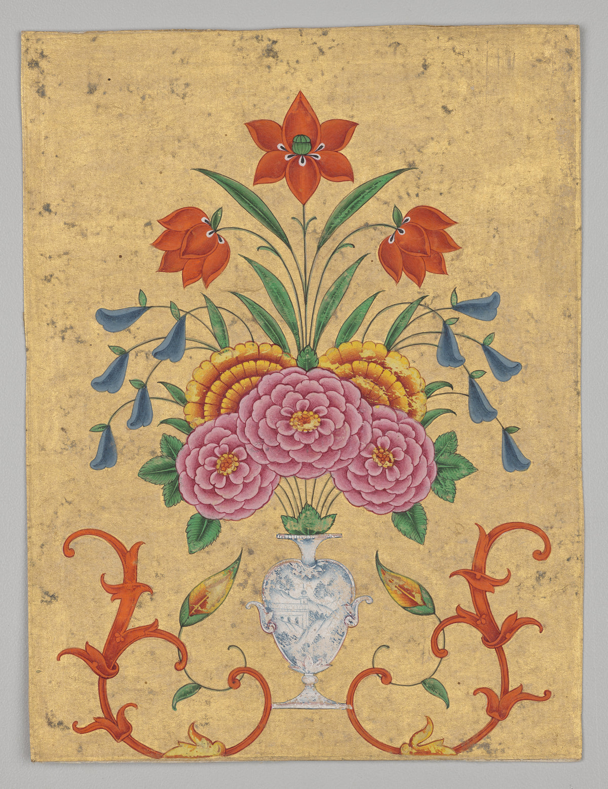 Vase with flower arrangement and scrollwork